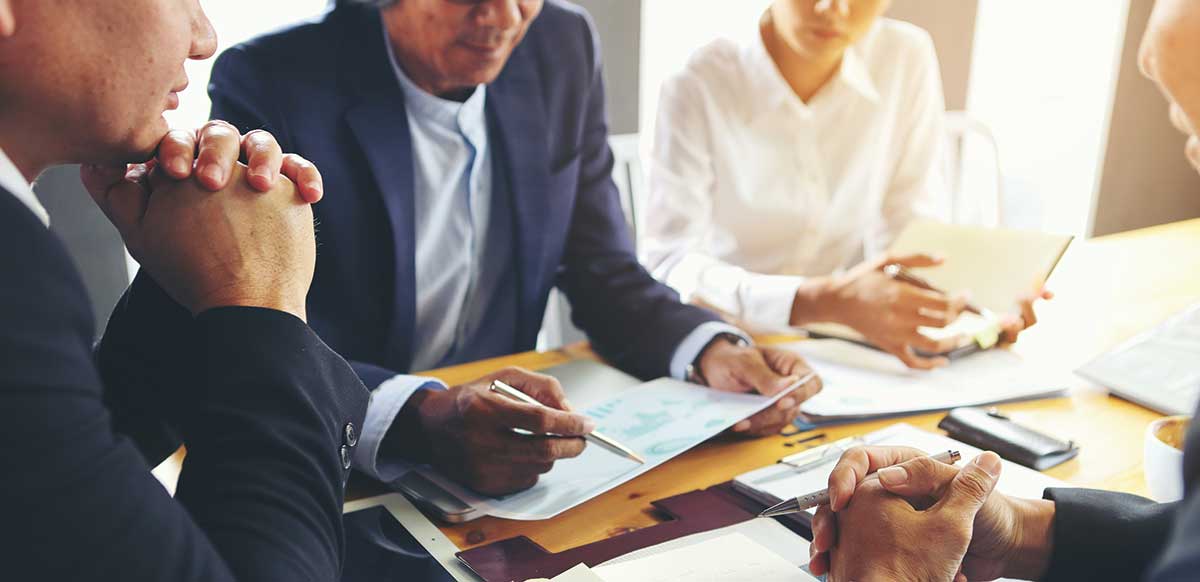 business people gathered around a table
